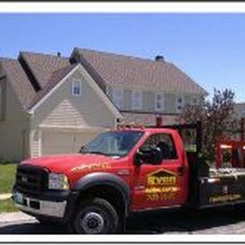Ryan Construction Systems - a red tow truck parked in front of a house - Roofing Near Me - Parkville, Missouri Ryan Construction Systems - a red tow truck parked in front of a house - Roofing Near Me - Parkville, Missouri