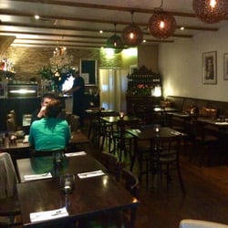 Brasserie L'ARRET Creperie - Warm, inviting interior at Brasserie L'Arrett