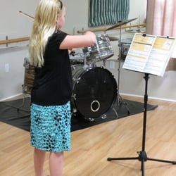 Allegro School of Music - A violin student warming up for her recital.