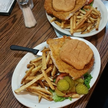Buddy's Place - Plate sized home-breaded tenderloin cut in 1/2 and put on 2 5" kaiser buns with home made fries. - American Near Me - Lancaster, Missouri