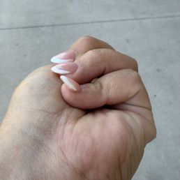 Crooked application of acrylic nail that took hours to do. Clearly didn't know what they were doing. Charged $90.