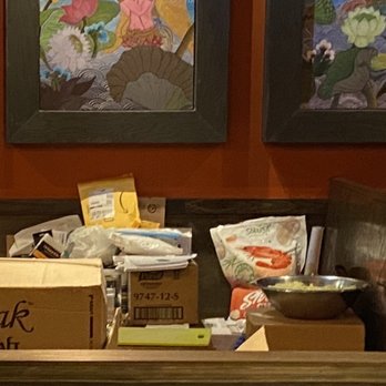 Thai Wisdom Bistro - Bowl of rice along with some other food packages such as pack of shrimp stacked on the dining tables - Thai Near Me - Kirkland, Washington