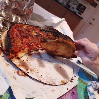 Burt's Place - Note the crust and overdone, charred bottom. - Pizza Near Me - Morton Grove, Illinois Burt's Place - Note the crust and overdone, charred bottom. - Pizza Near Me - Morton Grove, Illinois