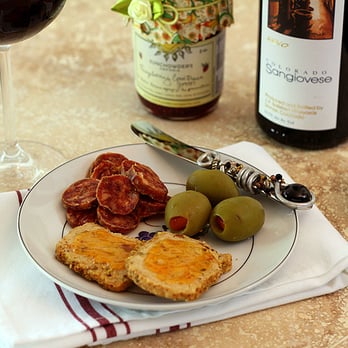 Paisano Sausage - a plate of food and a glass of wine - Meat Shops Near Me - Denver, Colorado Paisano Sausage - a plate of food and a glass of wine - Meat Shops Near Me - Denver, Colorado