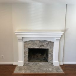 Ralph built out the accent wall, installed the stone on the face and the hearth, the mantel and the trim.  It's beautiful!