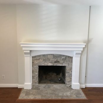Fireplace Improvements - Ralph built out the accent wall, installed the stone on the face and the hearth, the mantel and the trim.  It's beautiful! - Fireplace Services Near Me