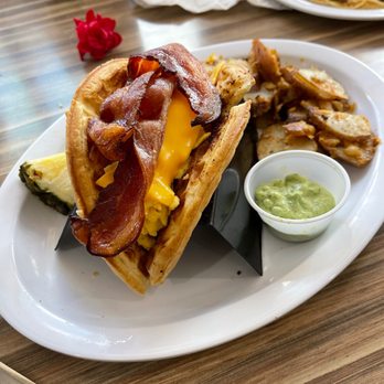 @ The Diner - Breakfast taco. The taco is made from waffles then stuffed with eggs cheese and bacon with a side of breakfast potatoes. - Breakfast & Brunch Near Me - Orlando, Florida @ The Diner - Breakfast taco. The taco is made from waffles then stuffed with eggs cheese and bacon with a side of breakfast potatoes. - Breakfast & Brunch Near Me - Orlando, Florida