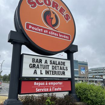 Scores - a large sign for a restaurant - Chicken Shop Near Me - Laval, Quebec