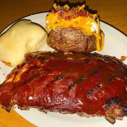 The "1/2 Slab of Ribs" meal with a loaded Baked Potato.