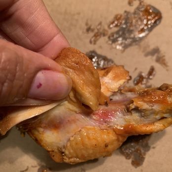 Rosati's Pizza - a hand holding a piece of pizza - Pizza Near Me - Round Lake Beach, Illinois