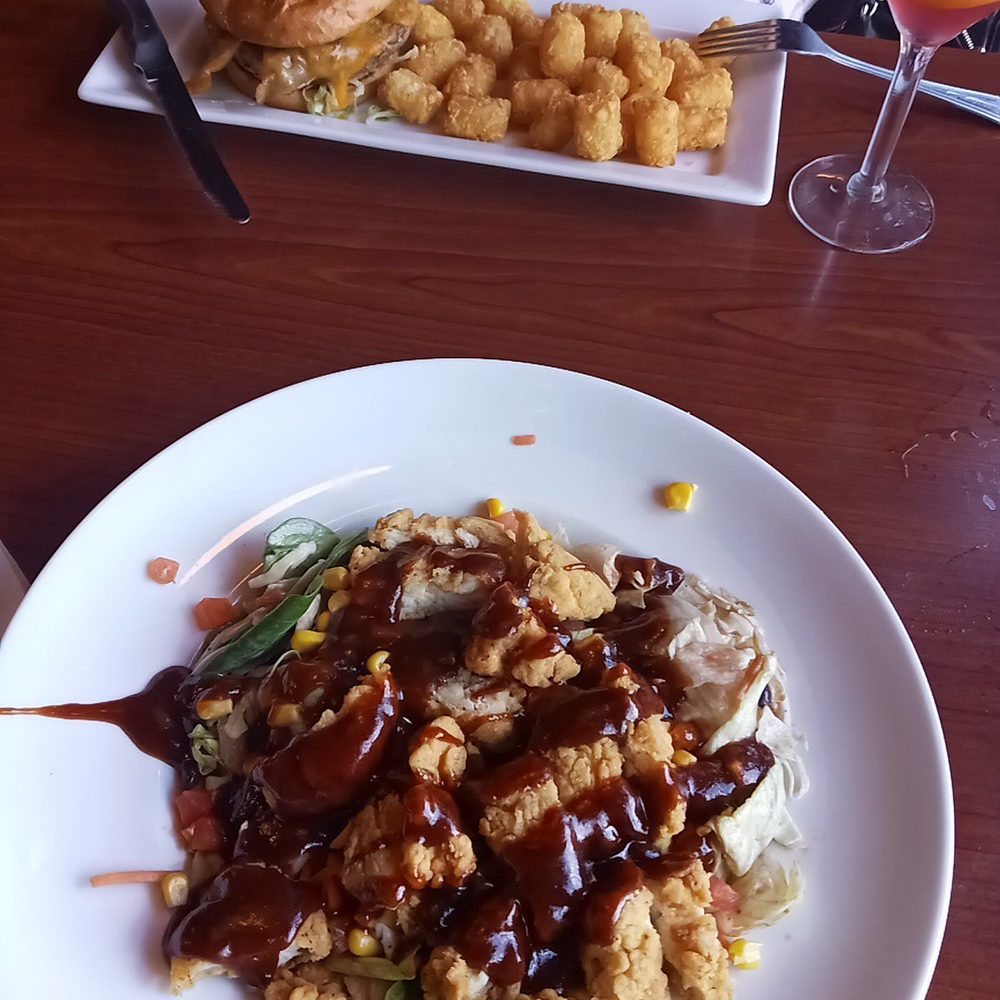 Ruby Tuesday - Foreground bbq chicken salad, background burger. - Burgers Near Me - Clermont, Florida Ruby Tuesday - Foreground bbq chicken salad, background burger. - Burgers Near Me - Clermont, Florida