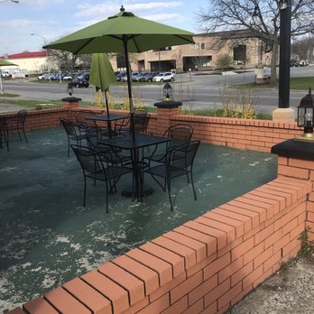 The Patio Restaurant - tables and chairs with an umbrella - Honduran Near Me - Newburgh, New York The Patio Restaurant - tables and chairs with an umbrella - Honduran Near Me - Newburgh, New York