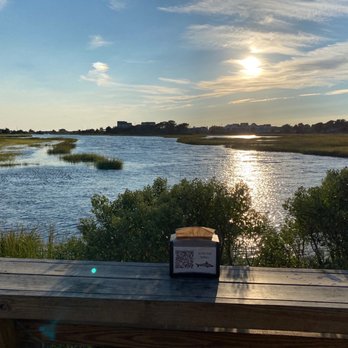 The Sand Bar - the sun setting over the water - Bars Near Me - West Dennis, Massachusetts The Sand Bar - the sun setting over the water - Bars Near Me - West Dennis, Massachusetts