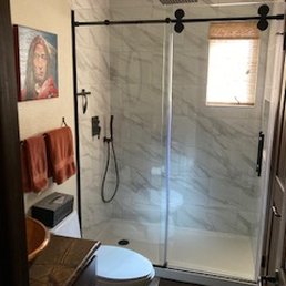a bathroom with a walk in shower