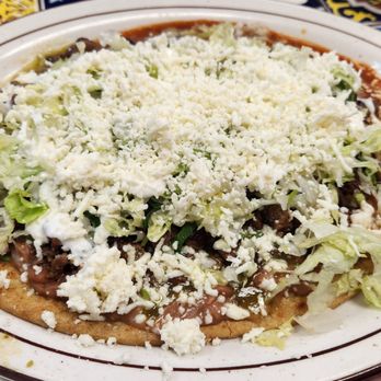 Los Corrales - Huarache with carne asada and red and green salsas - Mexican Near Me - Chicago, Illinois Los Corrales - Huarache with carne asada and red and green salsas - Mexican Near Me - Chicago, Illinois