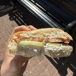 Plain toasted bagel with sliced tomato and cucumber with cream cheese Plain toasted bagel with sliced tomato and cucumber with cream cheese