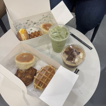 Tous les Jours - Tiramisu latte with soy milk, matcha latte, blueberry cream cheese bread, Belgium waffle, guava danish, and an almond danish - Bakeries Near Me - Honolulu, Hawaii Tous les Jours - Tiramisu latte with soy milk, matcha latte, blueberry cream cheese bread, Belgium waffle, guava danish, and an almond danish - Bakeries Near Me - Honolulu, Hawaii