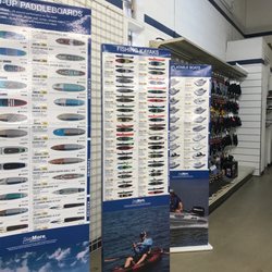 West Marine - They sell stand up paddle boards, fishing kayaks and inflatable boats!