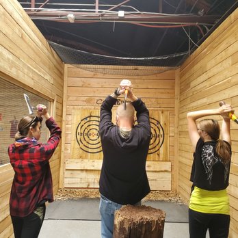 Class Axe Throwing & Bar - Kyle teaching the girls to throw axes. - Axe Throwing Near Me - Denver, Colorado