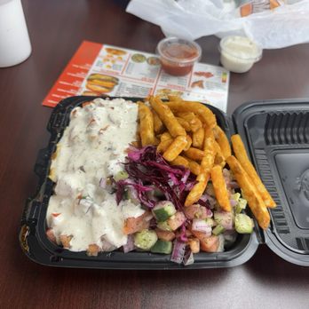 Halal Munchies - Chicken Over Rice Platter with fries and salad - Halal Near Me - Middletown, Ohio Halal Munchies - Chicken Over Rice Platter with fries and salad - Halal Near Me - Middletown, Ohio