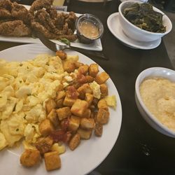 GoldRoom Restaurant & Lounge - 1 meat; 3 sides: eggs, potatoes, grits, for some reason I also received collard greens ‍. No complaints tho