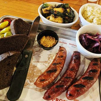 Krause's Cafe - Wild game sausage sampler with sides of kraut, red cabbage, and sprouts. - German Near Me - New Braunfels, Texas Krause's Cafe - Wild game sausage sampler with sides of kraut, red cabbage, and sprouts. - German Near Me - New Braunfels, Texas