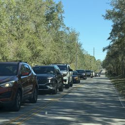 Line of cars waiting to get in the actual designated line for cars waiting to get in the park after we left the park Line of cars waiting to get in the actual designated line for cars waiting to get in the park after we left the park