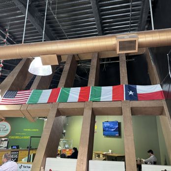 Bella Gente - The flags at the entrance. - Pizza Near Me - Fort Worth, Texas