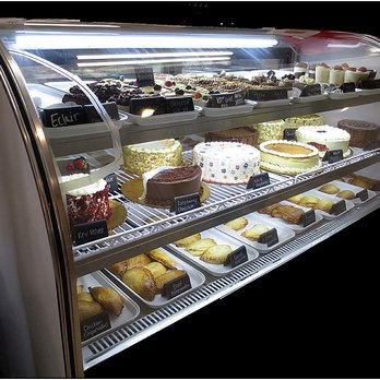Rustika Cafe and Bakery - They are a restaurant and a bakery. This is the cake display case. One of my other pictures shows a cookie display case. - Bakeries Near Me - League City, Texas Rustika Cafe and Bakery - They are a restaurant and a bakery. This is the cake display case. One of my other pictures shows a cookie display case. - Bakeries Near Me - League City, Texas