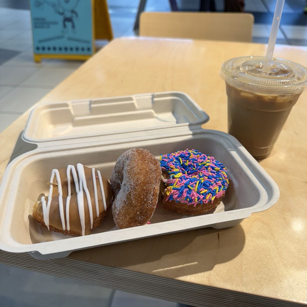 Hoopla Donuts - maple donut (v) cane sugar donut (v) vanilla donut (v) + iced latte - Donuts Near Me - Calgary, Alberta