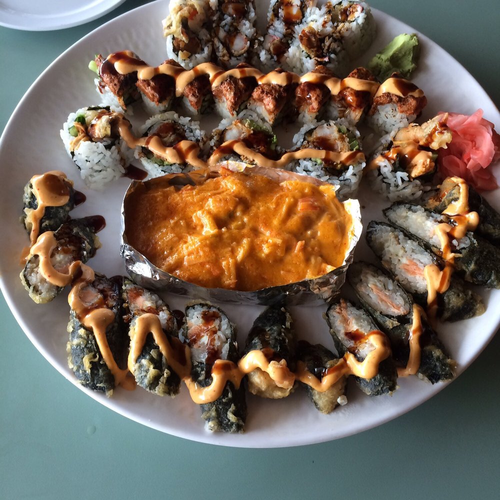 Dancing Roll - From top of plate to bottom: Shrimp Tempura Roll, Dynamite Roll, Bengal Roll, Volcano Roll, Sunday Morning Roll. All are so delicious! - Sushi Bars Near Me - West Chester, Ohio Dancing Roll - From top of plate to bottom: Shrimp Tempura Roll, Dynamite Roll, Bengal Roll, Volcano Roll, Sunday Morning Roll. All are so delicious! - Sushi Bars Near Me - West Chester, Ohio