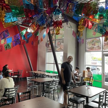 La Poblanita - The fun decoration over head. However, I wish the tables could be a bit cleaner? - Mexican Near Me - Aloha, Oregon