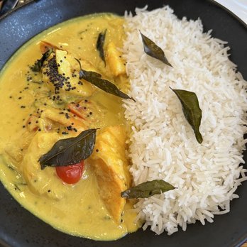 Windmills - Seafood Moilee $29 for a few chunks of cod, 3 shrimp, 2 cherry tomatoes cut in half in coconut curry sauce. - Indian Near Me - The Colony, Texas Windmills - Seafood Moilee $29 for a few chunks of cod, 3 shrimp, 2 cherry tomatoes cut in half in coconut curry sauce. - Indian Near Me - The Colony, Texas