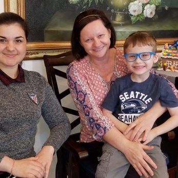 Bellevue Elderly Care - The caregivers with the provider's son. Enjoying a Christmas party. - Elder Care Planning Near Me - Bellevue, Washington