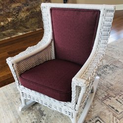 92 year old antique child's wicker rocking chair.