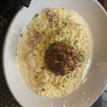 Tuscany Ristorante - Some kind of seafood risotto with a crab cake on top - Italian Near Me - Williamsburg, Virginia Tuscany Ristorante - Some kind of seafood risotto with a crab cake on top - Italian Near Me - Williamsburg, Virginia