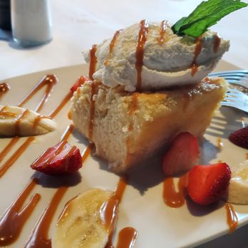 Table 31 - Tres Leche cake with fruit and drizzled carmel - New American Near Me - Mooresville, North Carolina Table 31 - Tres Leche cake with fruit and drizzled carmel - New American Near Me - Mooresville, North Carolina