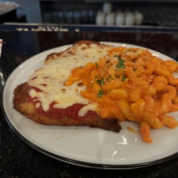 Pazza on Porter - Chicken Parmigiana with Fusilli and Vodka sauce - Italian Near Me - Boston, Massachusetts Pazza on Porter - Chicken Parmigiana with Fusilli and Vodka sauce - Italian Near Me - Boston, Massachusetts