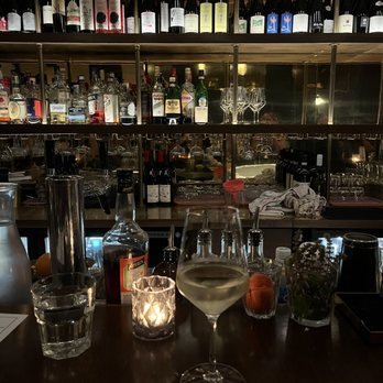 Renzo - a bar with wine glasses and a menu - Pizza Near Me - Charleston, South Carolina Renzo - a bar with wine glasses and a menu - Pizza Near Me - Charleston, South Carolina