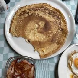 Dutch pancake, extra crispy "bacon", and fried eggs. Dutch pancake, extra crispy "bacon", and fried eggs.