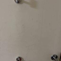 Hard to tell, but there are oily handprints and dust on the bathroom door Hard to tell, but there are oily handprints and dust on the bathroom door