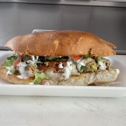 Torta de pollo (chicken) with lettuce, tomatoes, onions, cilantro, avocado, cheese and sour cream.