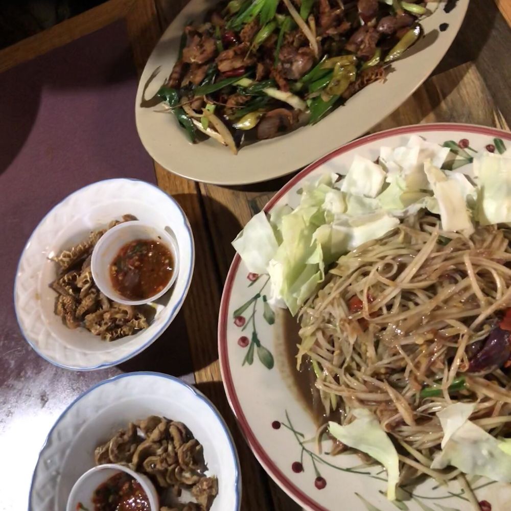 Papaya salad, stir fried giblets, cracklings with hot pepper dip Papaya salad, stir fried giblets, cracklings with hot pepper dip