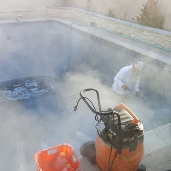 Infinity Pools - Acid-washing the minipebble - General Contractors Near Me - Costa Mesa, California