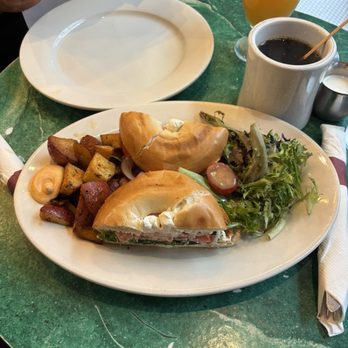Cafe Bonjour - Bagel with lox cream cheese, capers, lettuce, tomatoes, and a side of potatoes - Breakfast & Brunch Near Me - Boston, Massachusetts