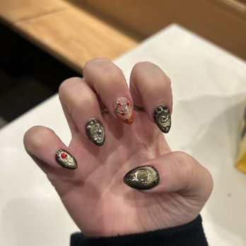 Zen Nails & Beauty - Acrylic nails with cat eye nail polish base, metallic designs, and gems. - Nail Salons Near Me - Bowie, Maryland