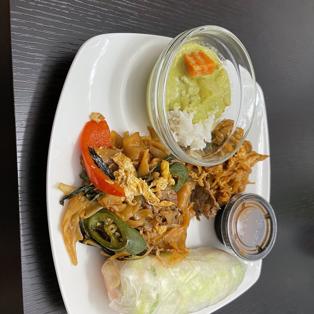 Thai Curry - a plate of food on a table - Thai Near Me - Cypress, Texas Thai Curry - a plate of food on a table - Thai Near Me - Cypress, Texas