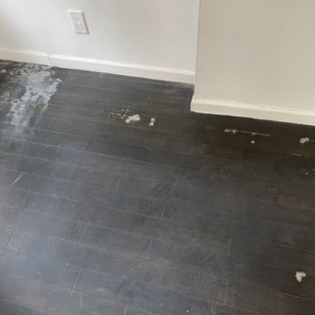 CMV Painting - Floor before with discoloration, rug tape and scratches - Painters Near Me