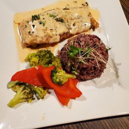 Salmon with wild rice, and seasoned vegetables. Salmon with wild rice, and seasoned vegetables.