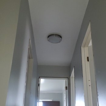 Phoenix Renovations & Design - a man moving boxes down a flight of stairs - General Contractors Near Me - Chicago, Illinois Phoenix Renovations & Design - a man moving boxes down a flight of stairs - General Contractors Near Me - Chicago, Illinois